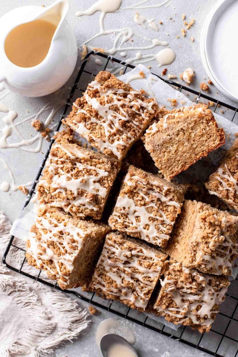 sliced brown butter maple crumb cake on parchment lined wire rack (1)