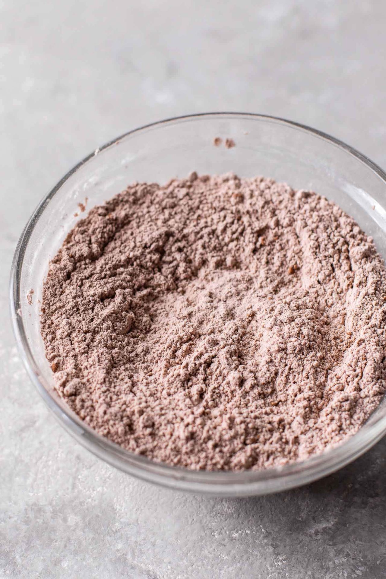 frosted red velvet cupcake cookies dry ingredients for cookie dough whisked together in bowl