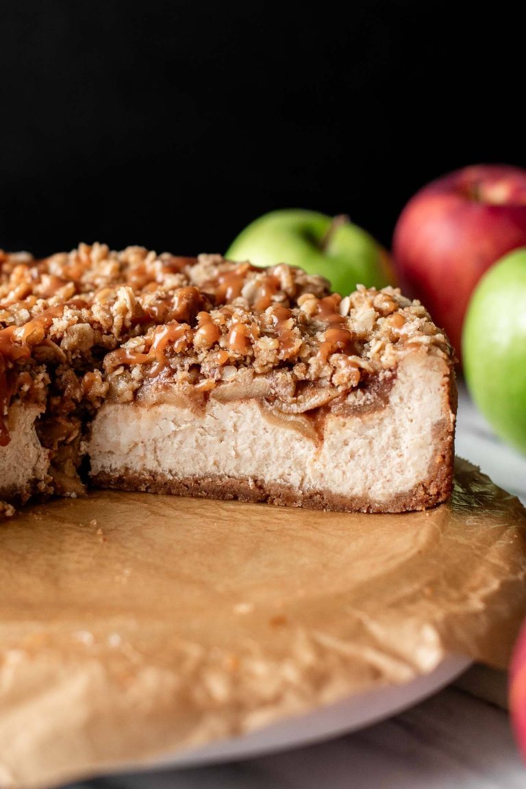 sliced apple crumble cheesecake on serving plate