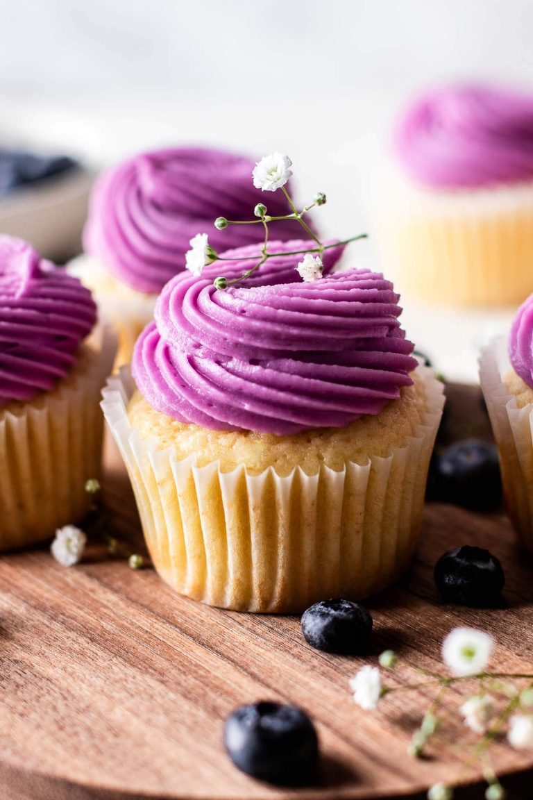 frosted Blueberry Lemon Cupcakes on wooden serving tray