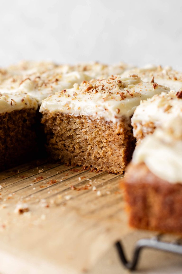sliced spice cake on parchment lined wire rack close up of inside texture