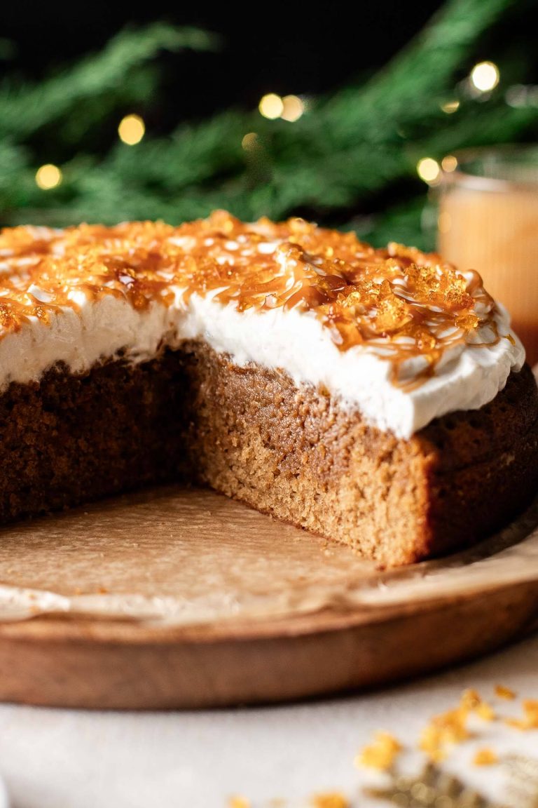 sliced caramel brulee latte cake on wooden cake plate