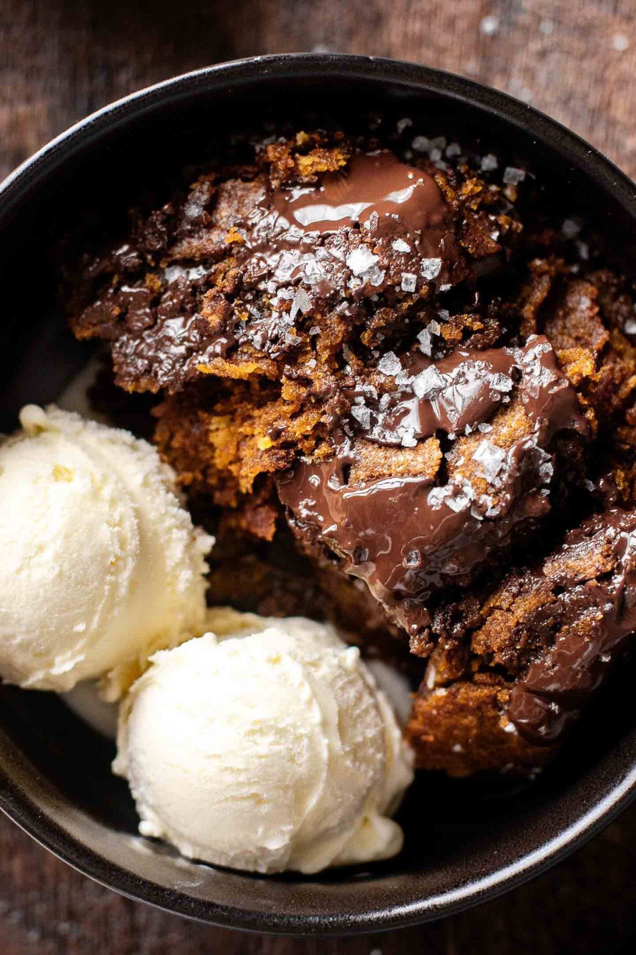 giant pumpkin chocolate chip cookie skillet scoop of cookie in bowl with ice cream on the side