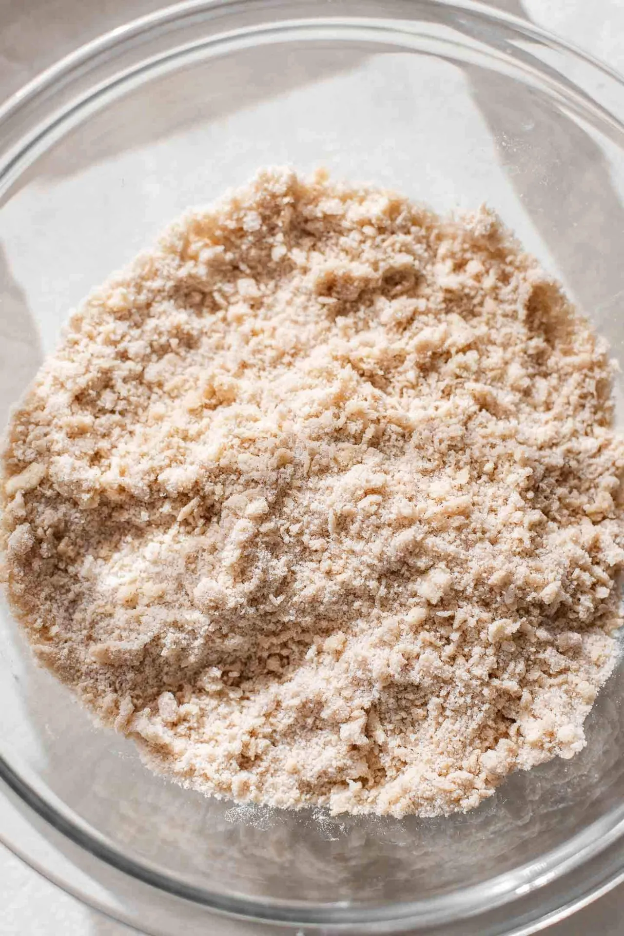 cinnamon roll ooey gooey butter cake butter and dry ingredients mixed together in bowl