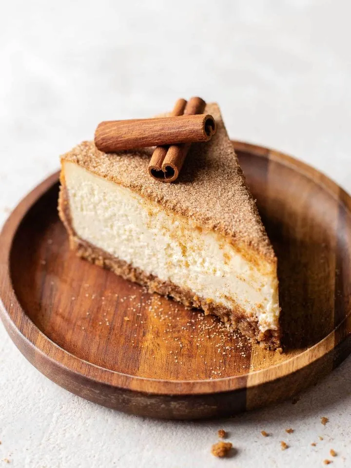 slice of sliced churros cheesecake in plate