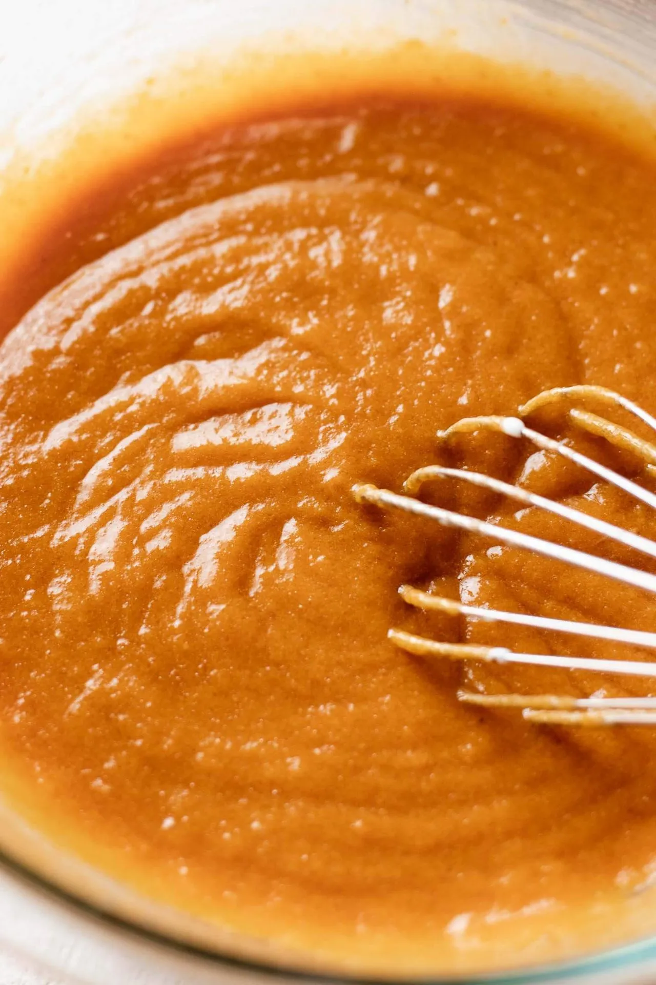 wet ingredients for pumpkin coffee cake whisked together in bowl