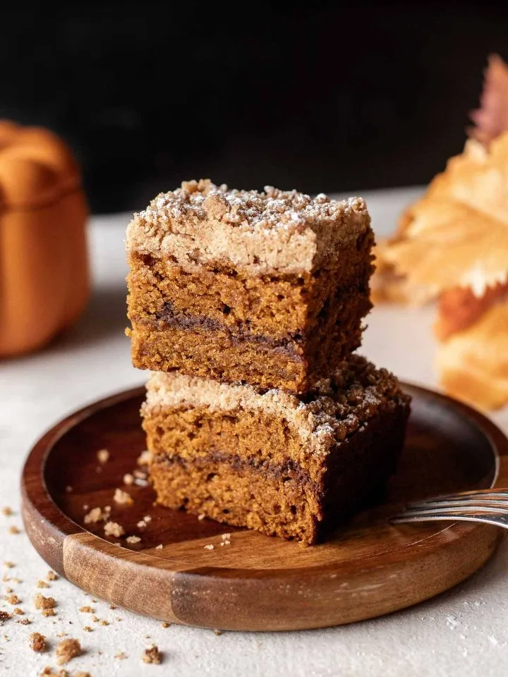2 slices of pumpkin coffee cake stacked in plate
